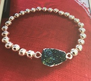 Rose Gold plated emerald coloured resin stone bracelet